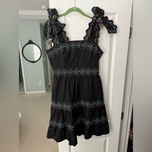 CeliaB black dress with bright colored accents and bow straps.